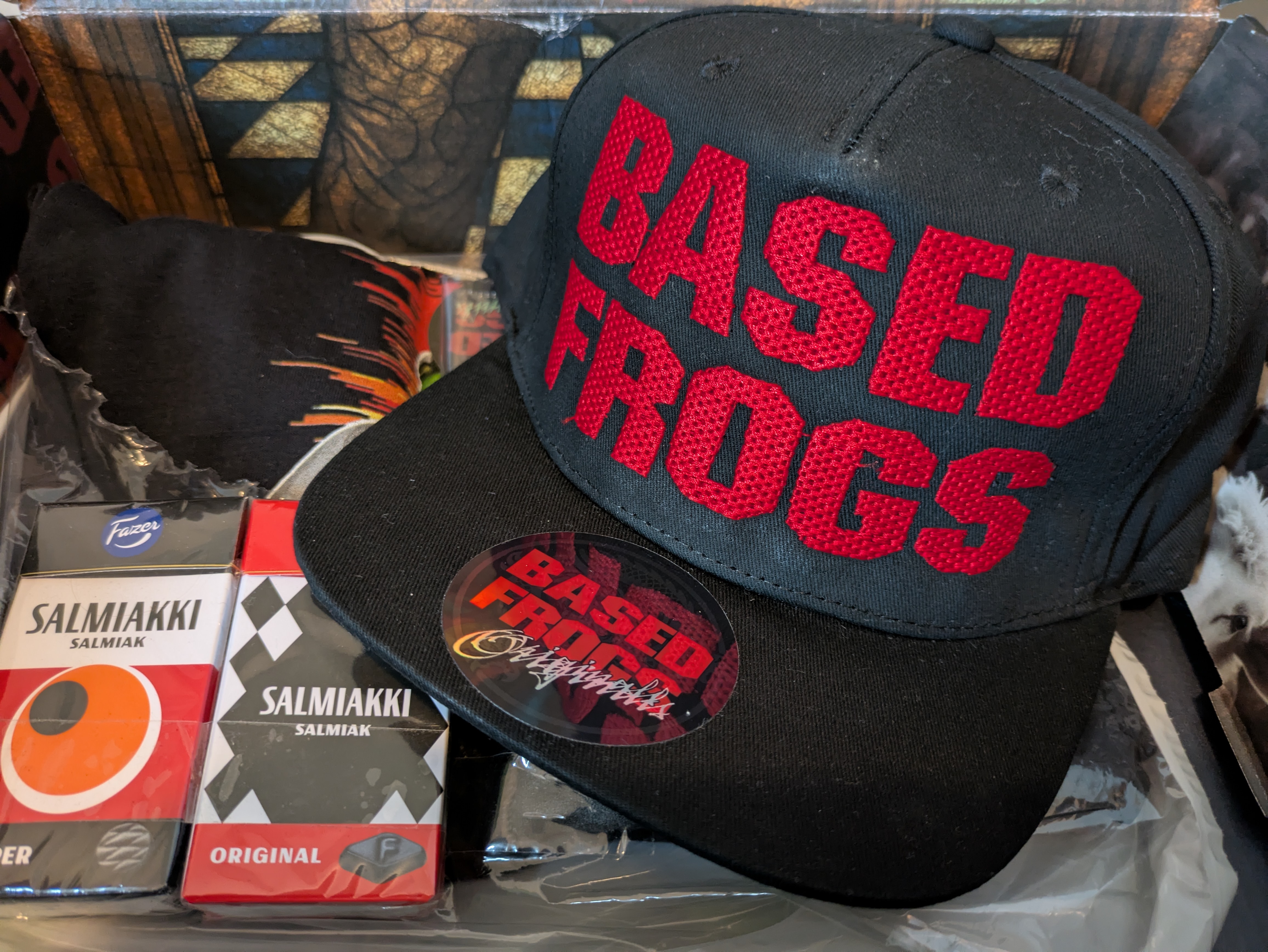 This is the main product, the Based Frogs Rare Snapback Cap. 😎
Two packs of Salmiakki as a special …