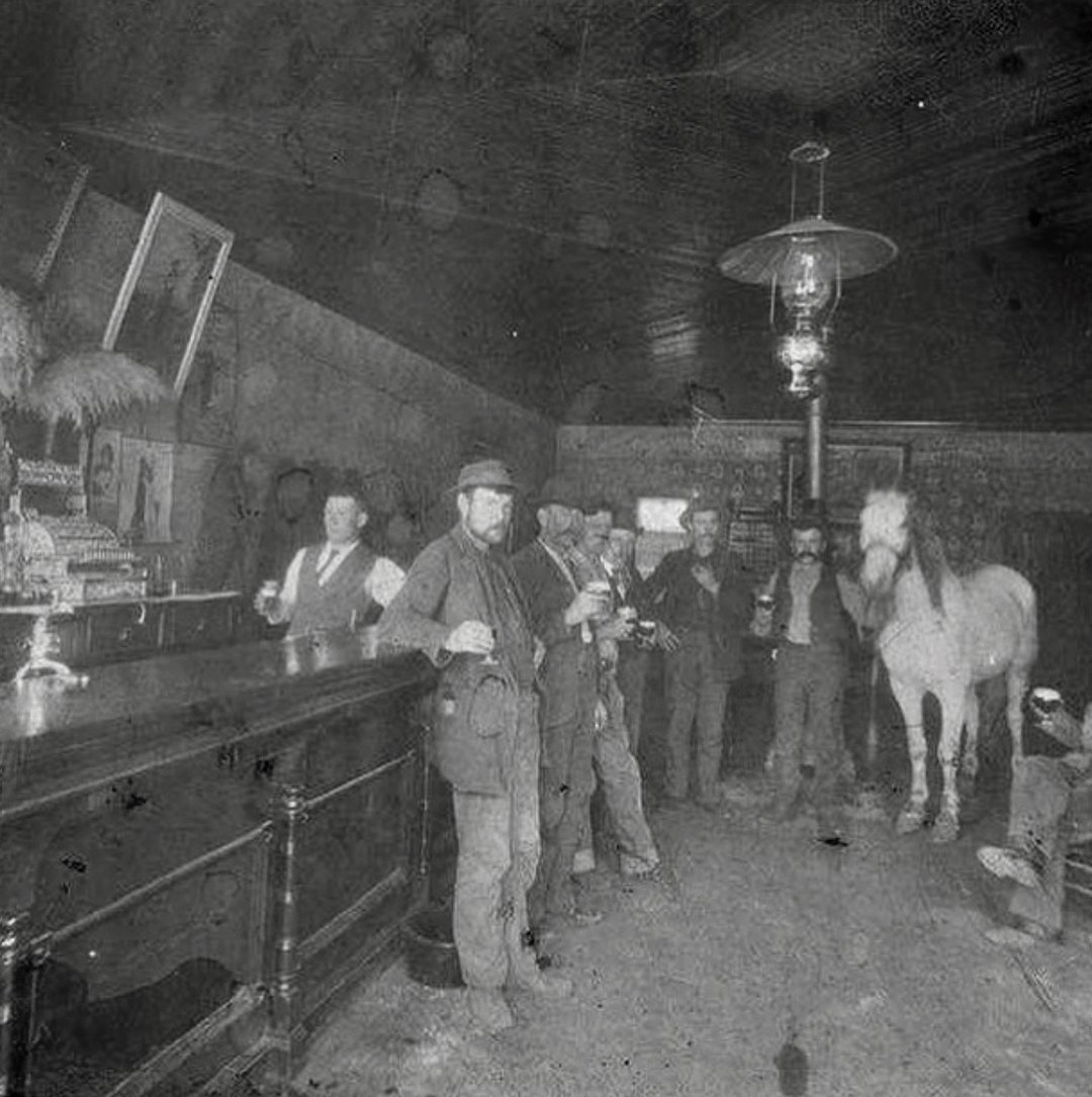 Castle Dale Saloon, Utah, USA, 1905. Horse and buggy people.