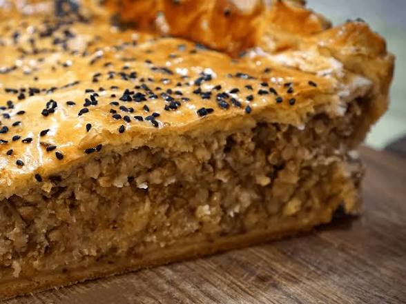 Yavoriv Pie (Yavorivskyi pyrih) is a traditional Ukrainian savory pastry from the Lviv region, feat…