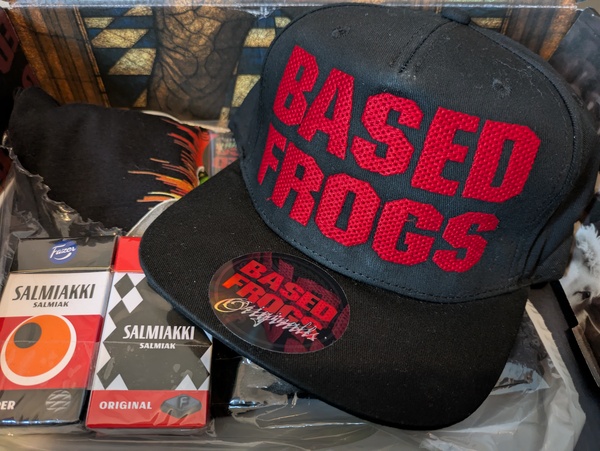 This is the main product, the Based Frogs Rare Snapback Cap. 😎
Two packs of Salmiakki as a special …