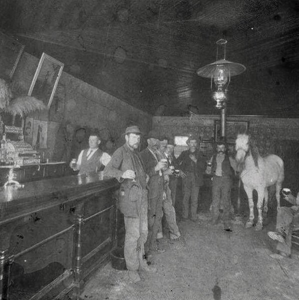 Castle Dale Saloon, Utah, USA, 1905. Horse and buggy people.